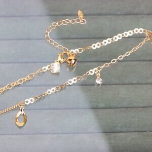 "Rose Gold Anklet with Hollow Charms and Bell, Elegant Chain Design, XPAL1062